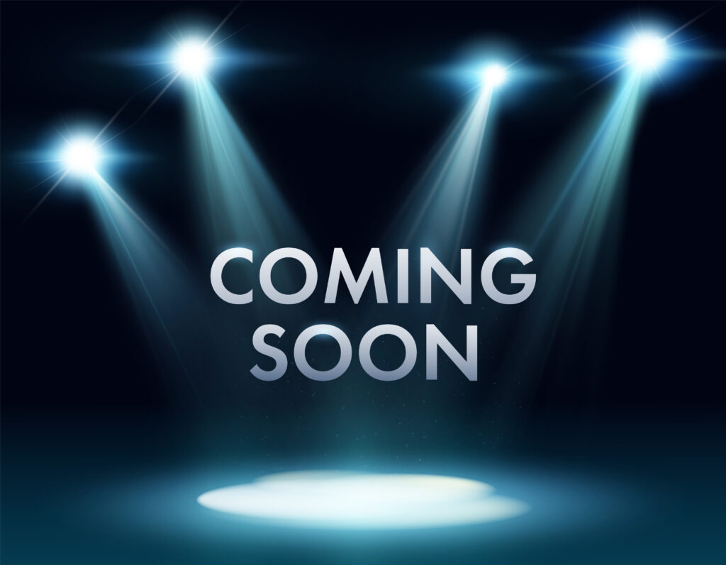 Coming Soon text with spotlights on him